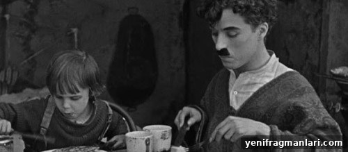 Charlie Chaplin's The Kid: 100-Year Anniversary Review 3 Scene from The Kid showing Chaplin and Jackie Coogan