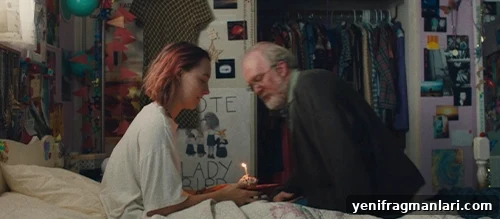10 Unforgettable Moments from Lady Bird 6 Larry giving Lady Bird a cupcake