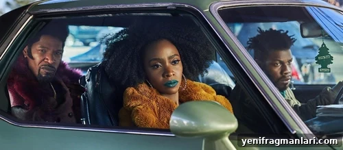 They Cloned Tyrone (2023) Movie Review: Plot, Cast & Verdict 3 Scene from They Cloned Tyrone showing the three leads in an urban setting