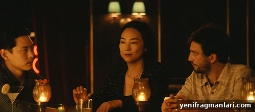 Past Lives (2023) Review: A Tender, Haunting Love Story 3 Still from Past Lives showing the three main characters at a bar