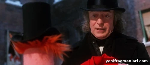 10 Unforgettable Muppet Christmas Carol Moments 11 Scrooge receives a scarf from Beaker, symbolizing his first received gift