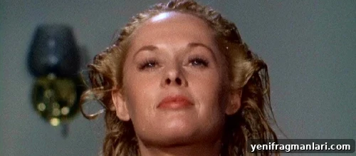 Tippi Hedren washing her hair and looking to the horizon in Alfred Hitchcock's 'Marnie'.