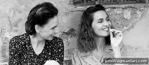 There Is Still Tomorrow, Neorealism, and Voting Rights 3 Black and white still of two women laughing and smoking in the 2023 Italian film 'C'e Ancora Domani'.