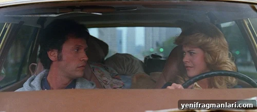 10 Iconic When Harry Met Sally Moments 2 Billy Crystal (left) looks at Meg Ryan (right) as she drives in a great romantic comedy movie.