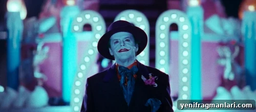 10 Iconic Batman Moments That Shaped the Dark Knight 7 Jack Nicholson dressed as the Joker in 'Batman' (1989), backlit by a colourful parade float in-film.