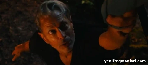 10 Iconic Dr. Alan Grant Moments from Jurassic Park 3 Jeff Goldblum hanging on to a hand, bathed in red light, while playing Dr Ian Malcolm in 2022 Universal feature film 'Jurassic World Dominion'.