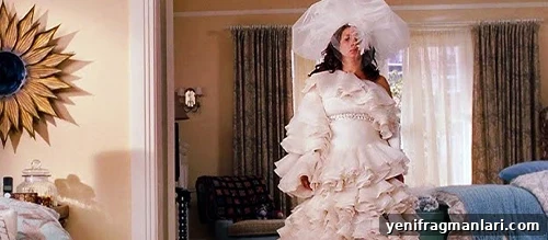 10 Unforgettable Bridesmaid Moments That Stole the Show 5 Maya Rudolph test-wears an extravagant wedding dress in 'Bridesmaids' (2011).