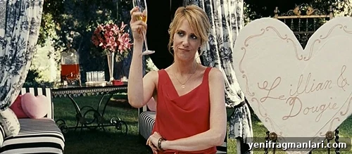 10 Unforgettable Bridesmaid Moments That Stole the Show 9 Kristen Wiig raises a glass in 'Bridesmaids' (2011).