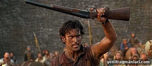 Top 10 Iconic Evil Dead Moments 4 Bruce Campbell holds a shotgun aloft in 'Army of Darkness'.