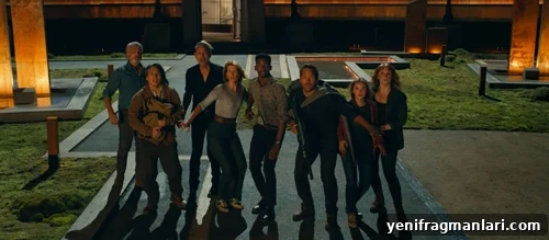 The full cast of 'Jurassic World Dominion' stare towards the camera, fearful of a ginormous dinosaur.