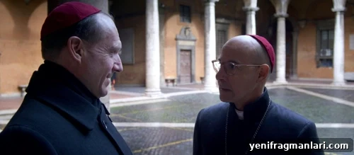 Ralph Fiennes (left) and Stanley Tucci (right) in religious thriller feature film 'Conclave' (2024).