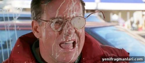 10 Unforgettable Jingle All the Way Moments 2 Phil Hartman with his glasses bent out of shape and egg nog all over his face in 'Jingle All the Way' (1996).