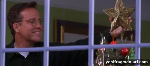 10 Unforgettable Jingle All the Way Moments 4 Phil Hartman, as Ted, places the star on top of Arnie's tree in 'Jingle All the Way' (1996).