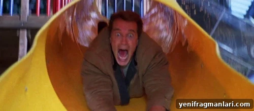 10 Unforgettable Jingle All the Way Moments 7 Arnold Schwarzenegger goes head first down a slide in 'Jingle All the Way' (1996).
