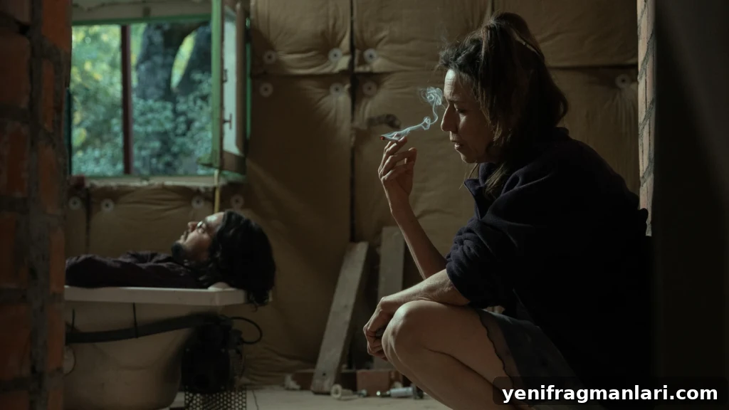 La Bola Negra: Queer History, Art, Desire and Legacy 8 A woman smokes while a man lies on a bench in an unfinished room in La Bola Negra